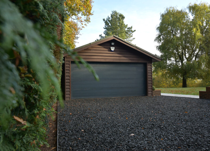 Different gravel driveway edging options including stone, brick, timber, concrete, and metal borders around decorative gravel.